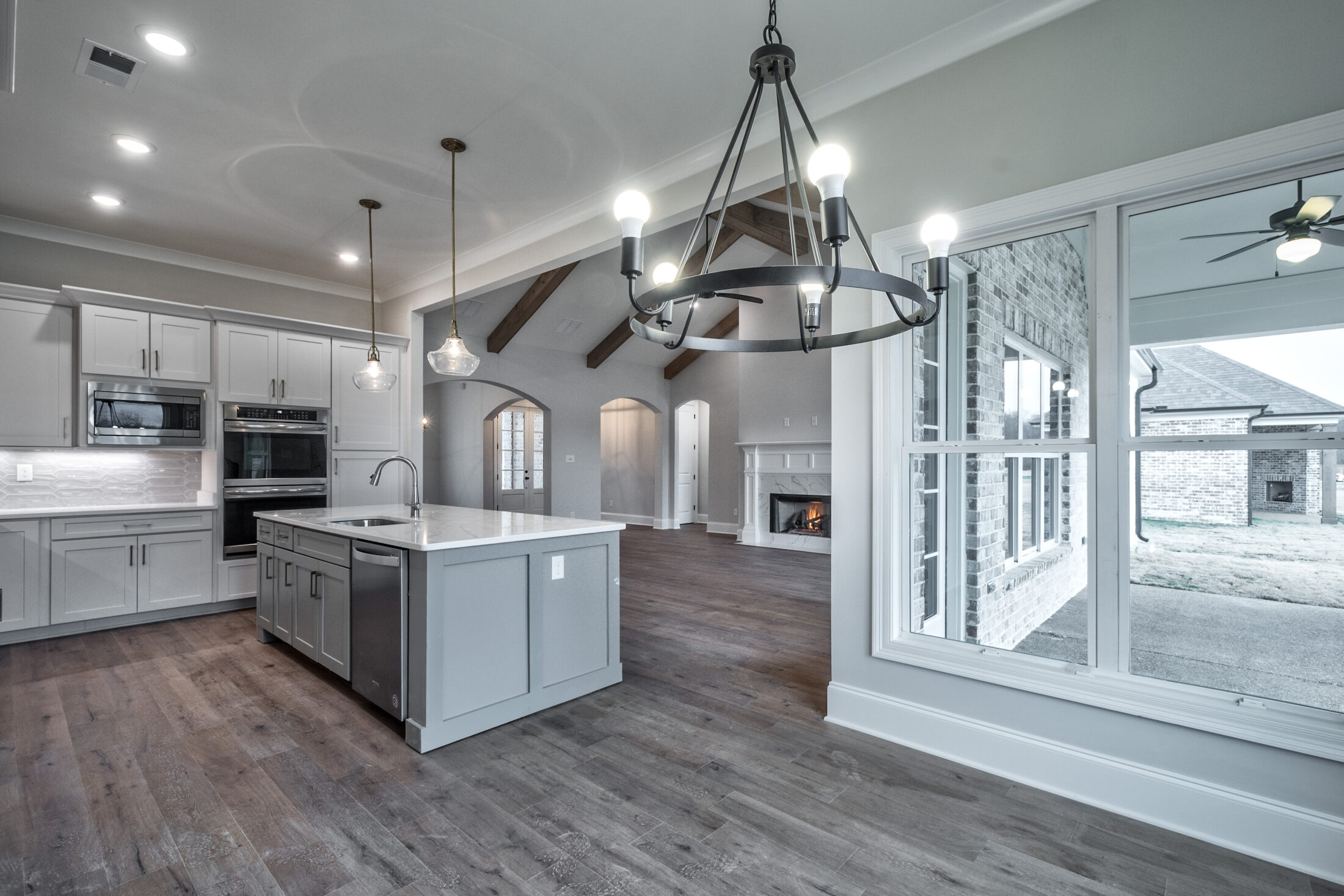 custom kitchen and living space in new home by OakRun Homes